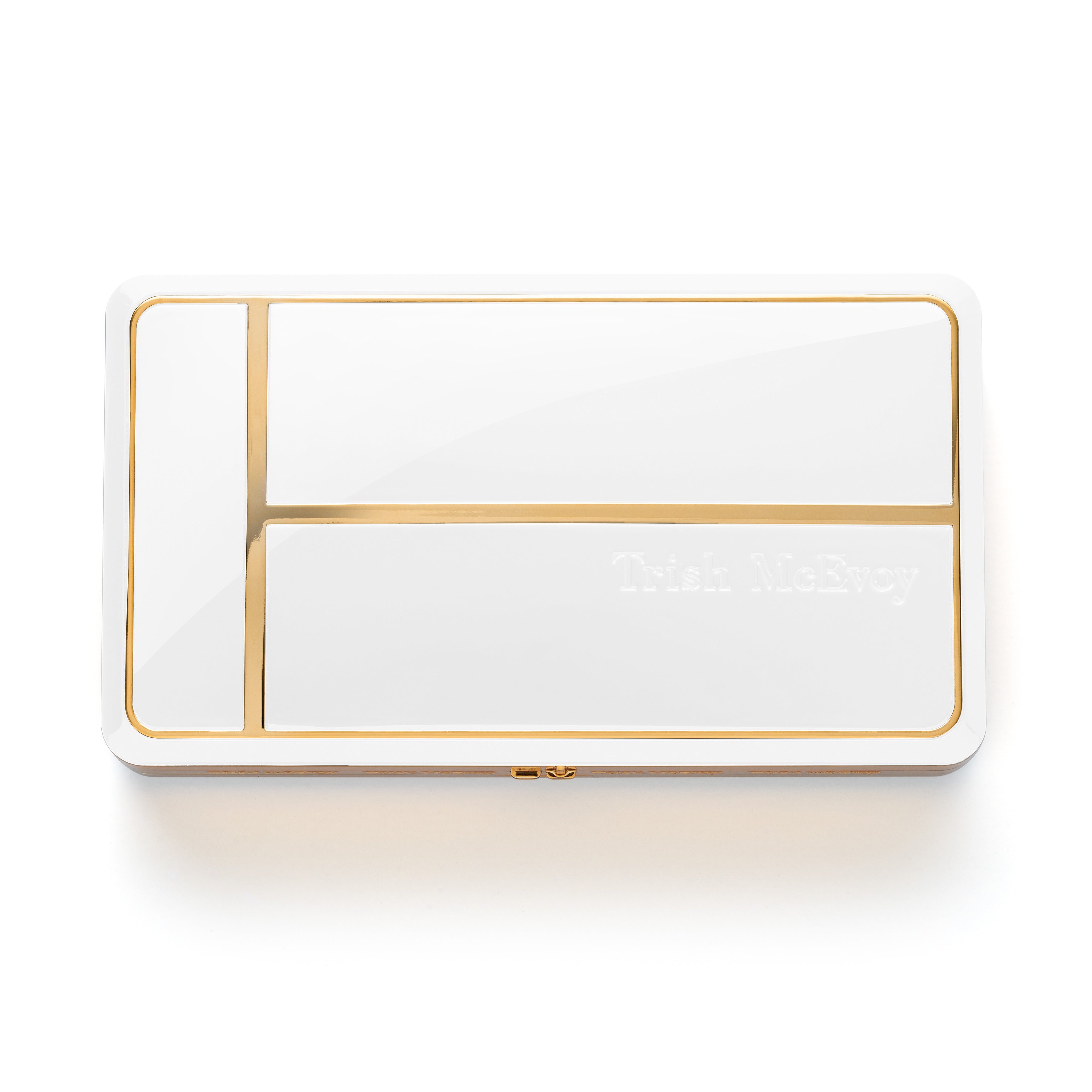 White compact with gold trim on a white background
