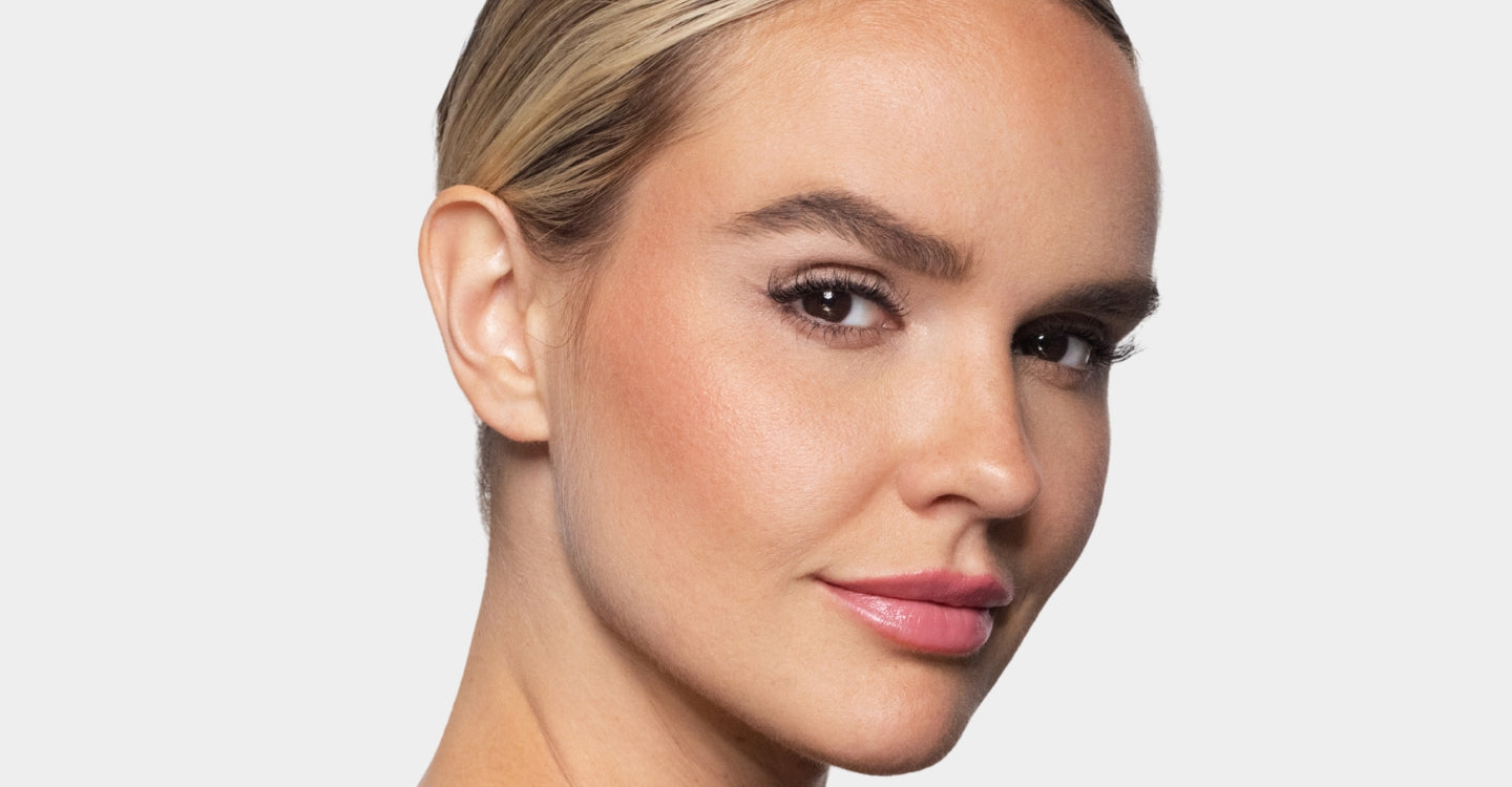 Close-up of a woman's face with a neutral background