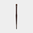 Makeup brush with brown handle and black bristles on a light gray background