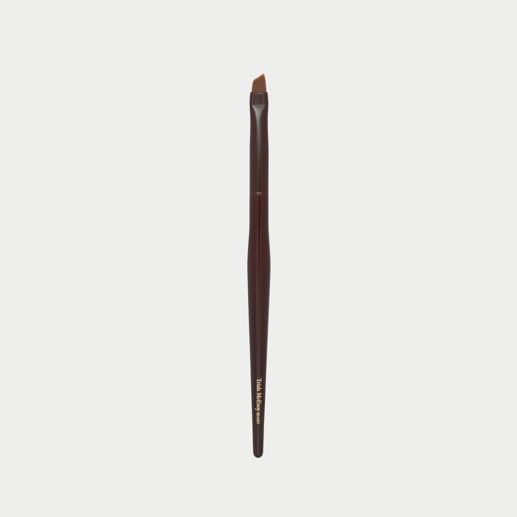 Makeup brush 50 with brown handle and black bristles on a white background