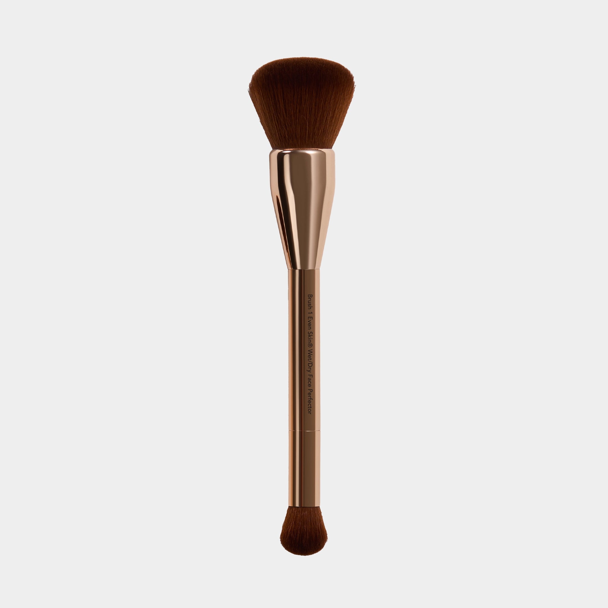wet dry perfector Makeup brush with brown bristles and gold metallic handle on a white background