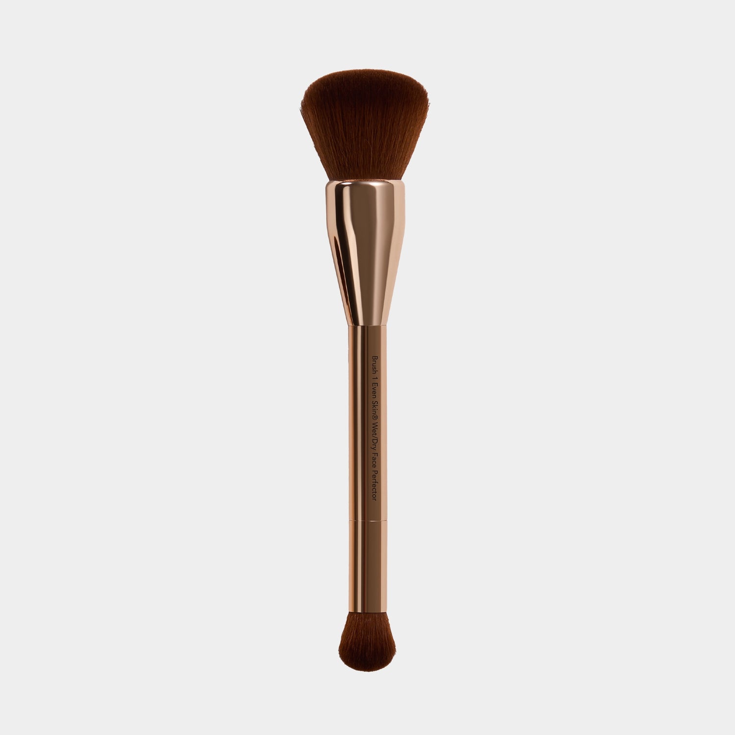wet dry perfector Makeup brush with brown bristles and gold metallic handle on a white background