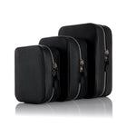 Set of three black leather planners  with silver zippers on a white background