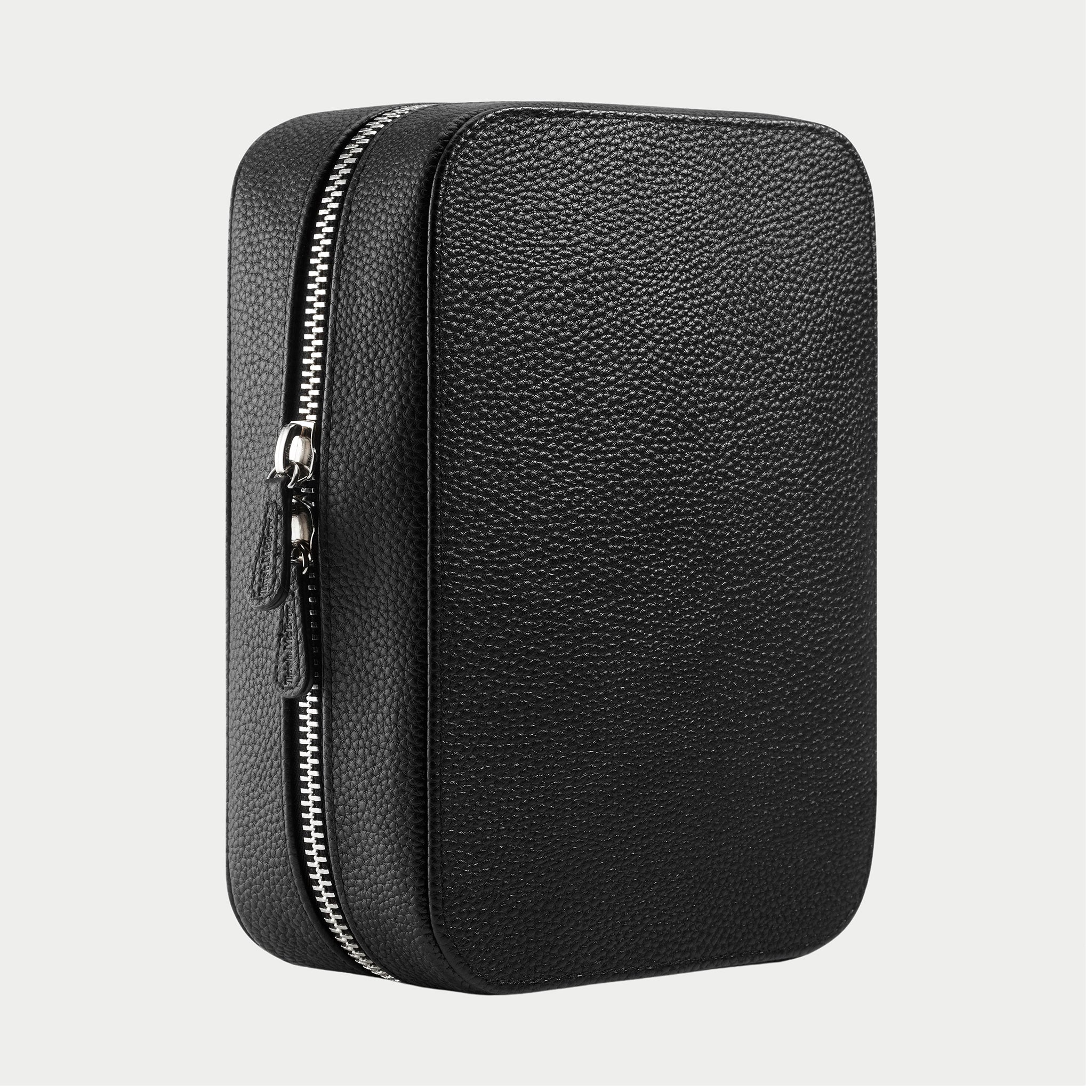Black leather travel case with zipper on a light gray background
