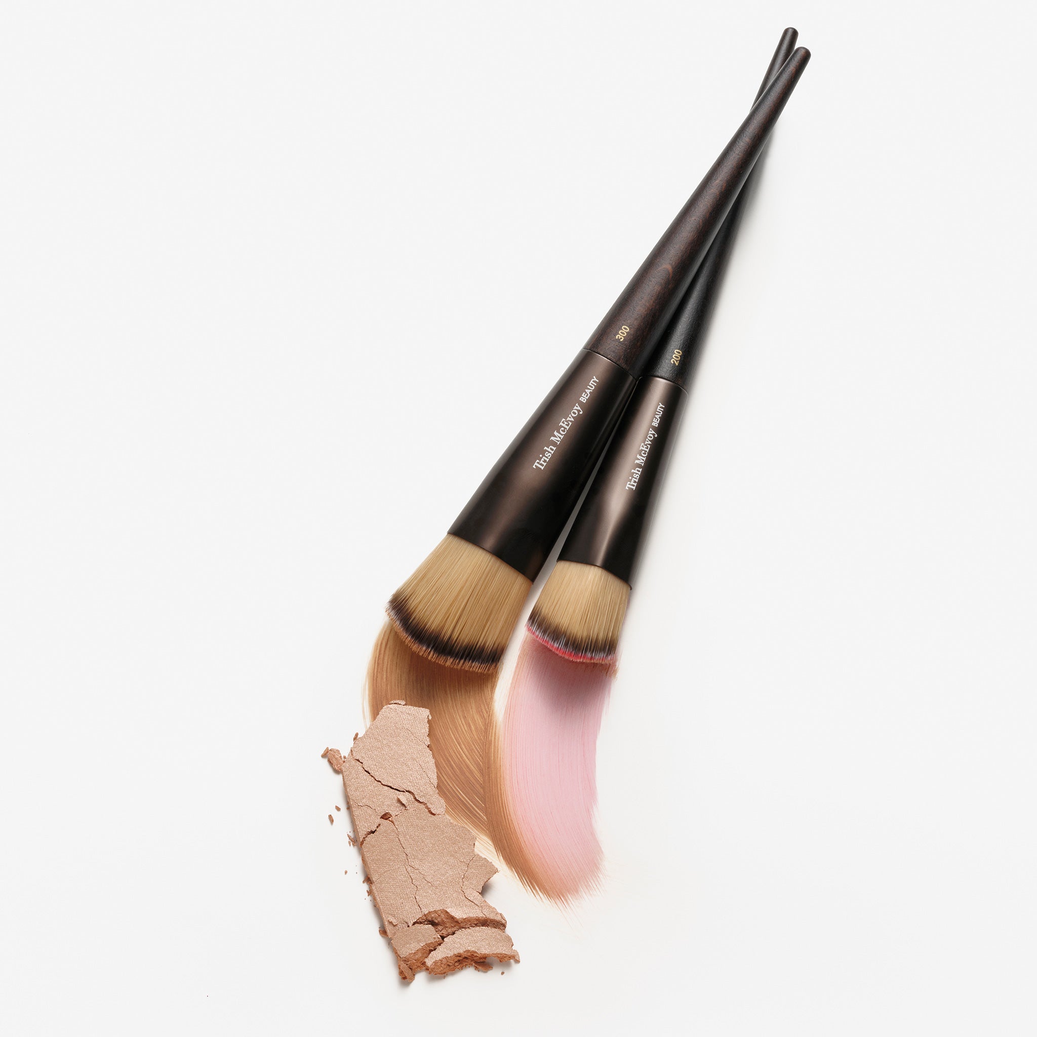 Makeup 200 brushes and brown powder on a white background