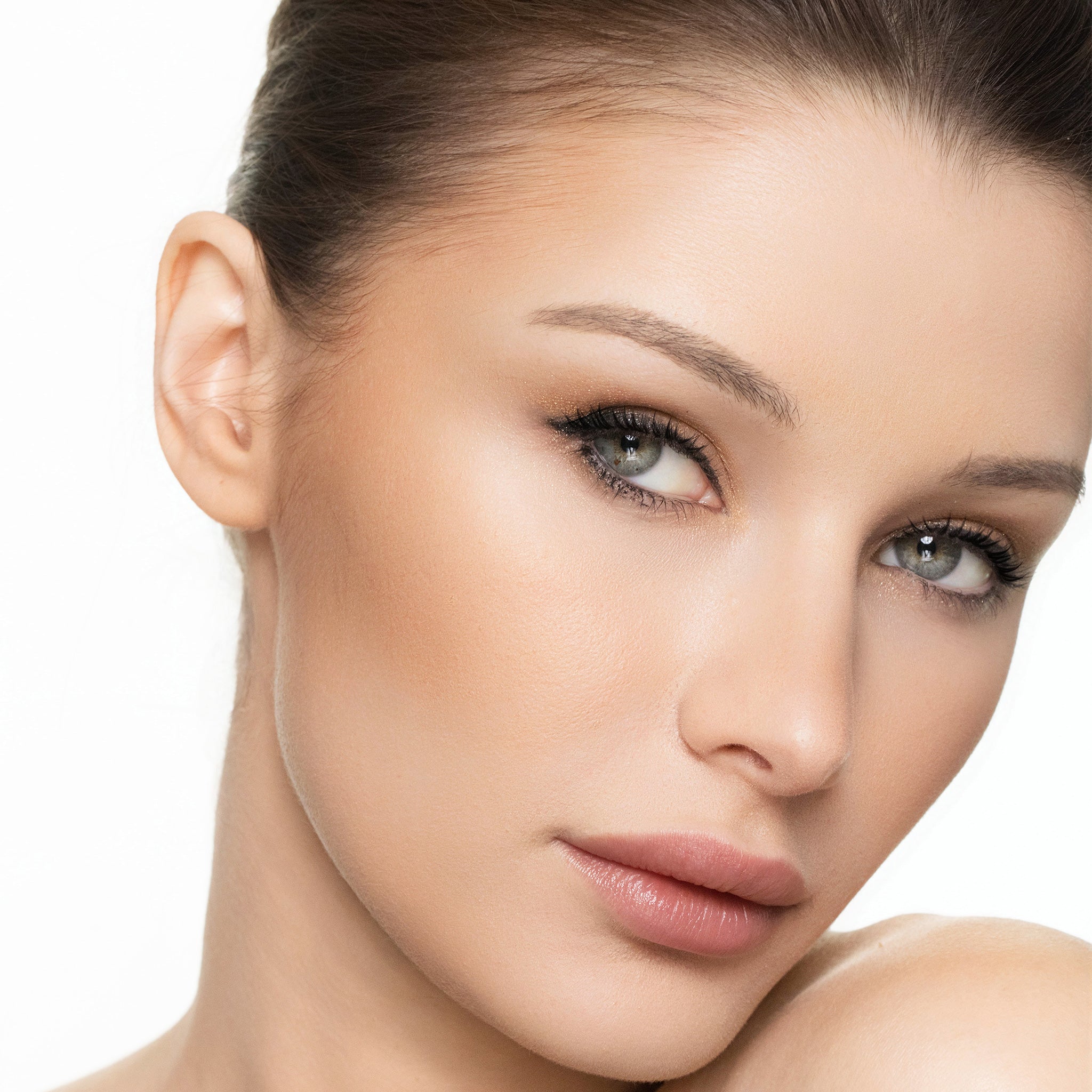 Close-up of a woman's face with a neutral background