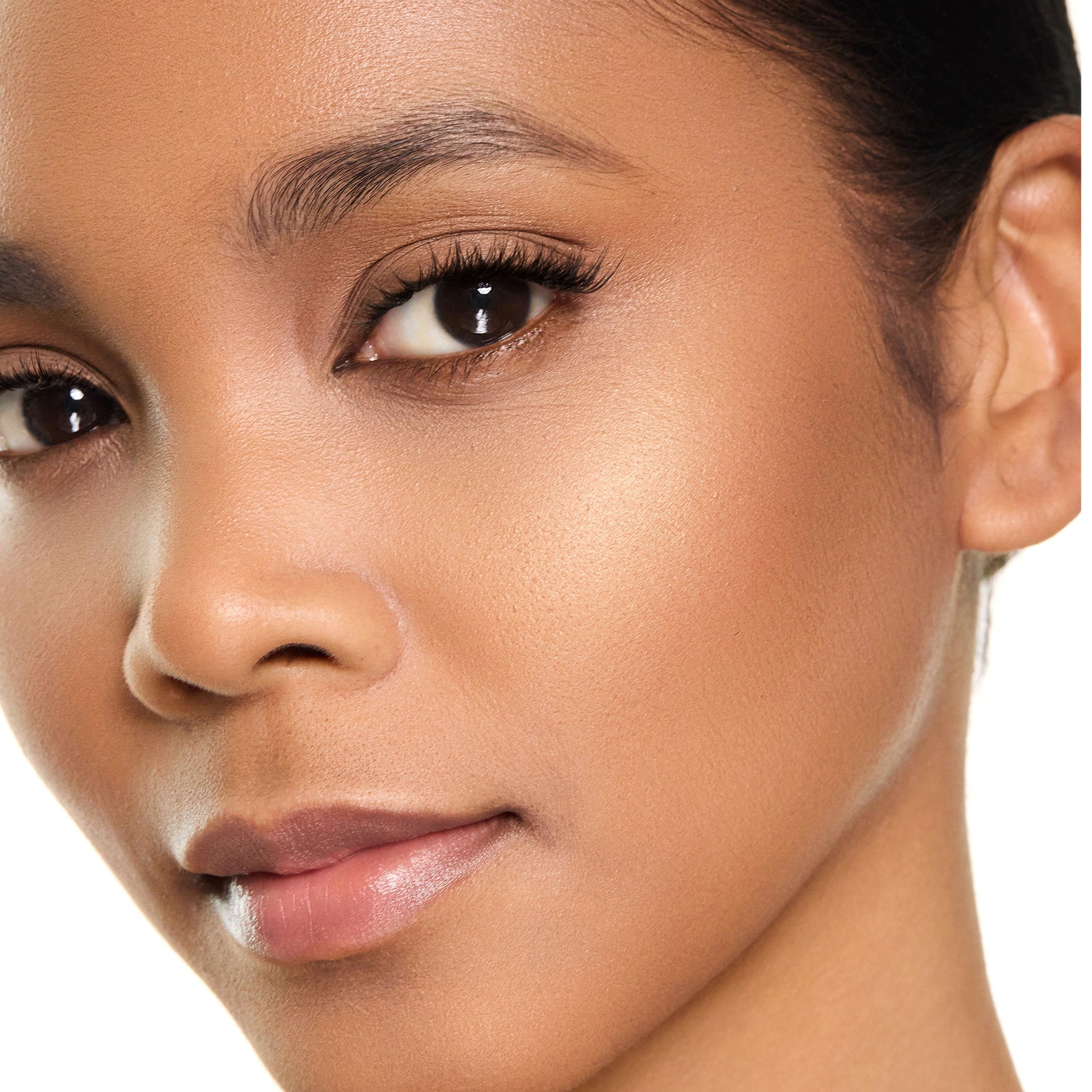 Close-up of a woman's face showing dual resort with a neutral background