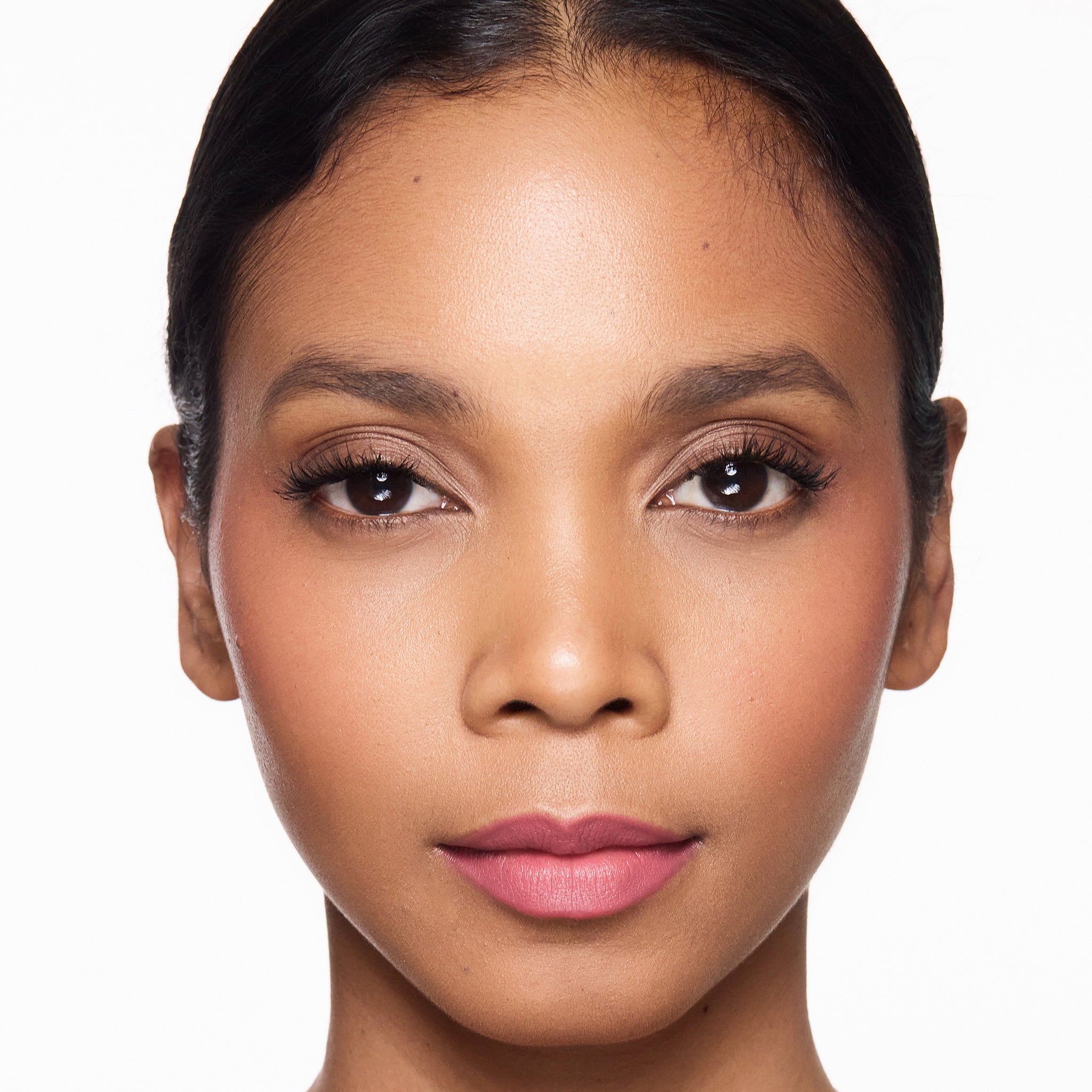 Close-up of a woman's face with a neutral background
