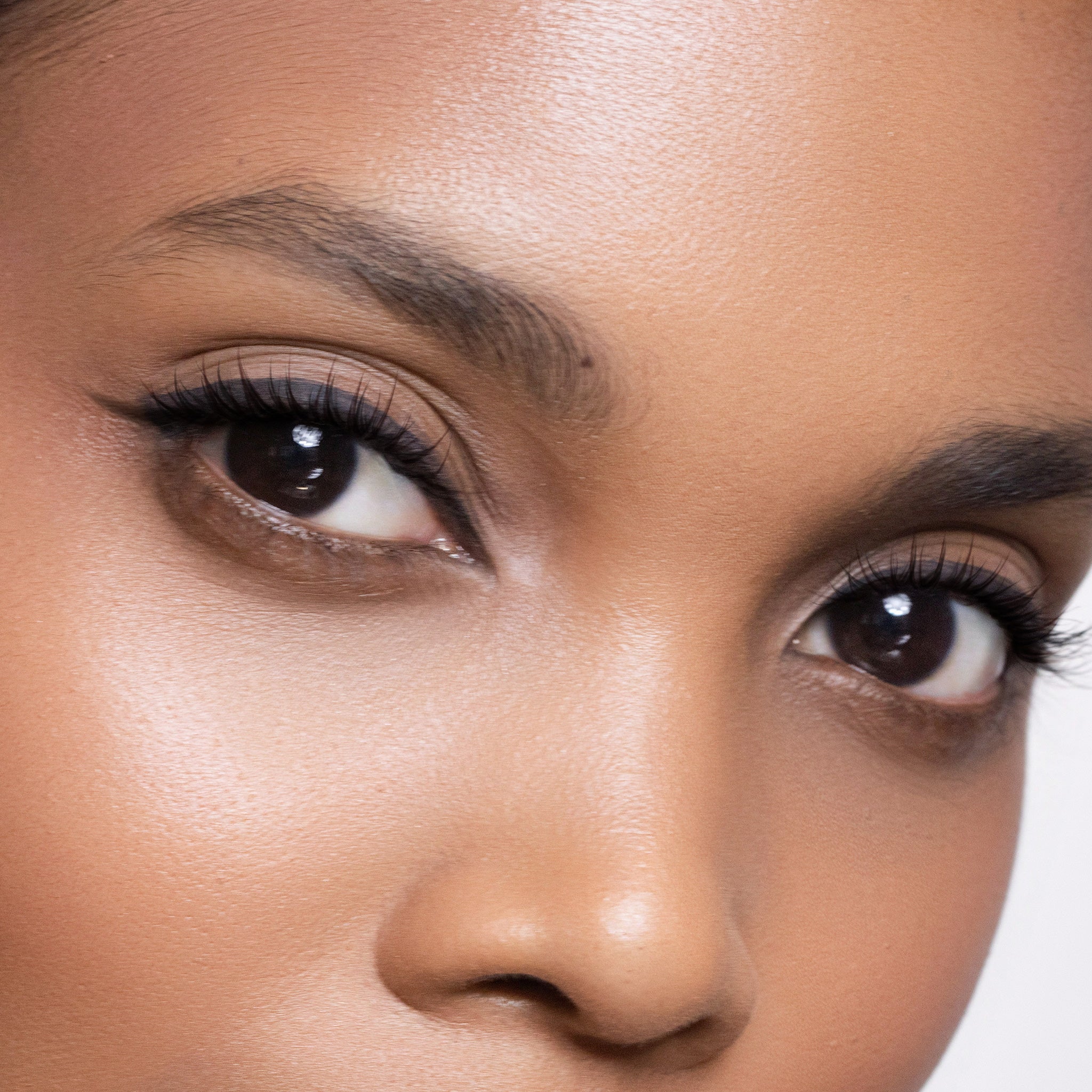 Close-up of a woman's eyes with a neutral background