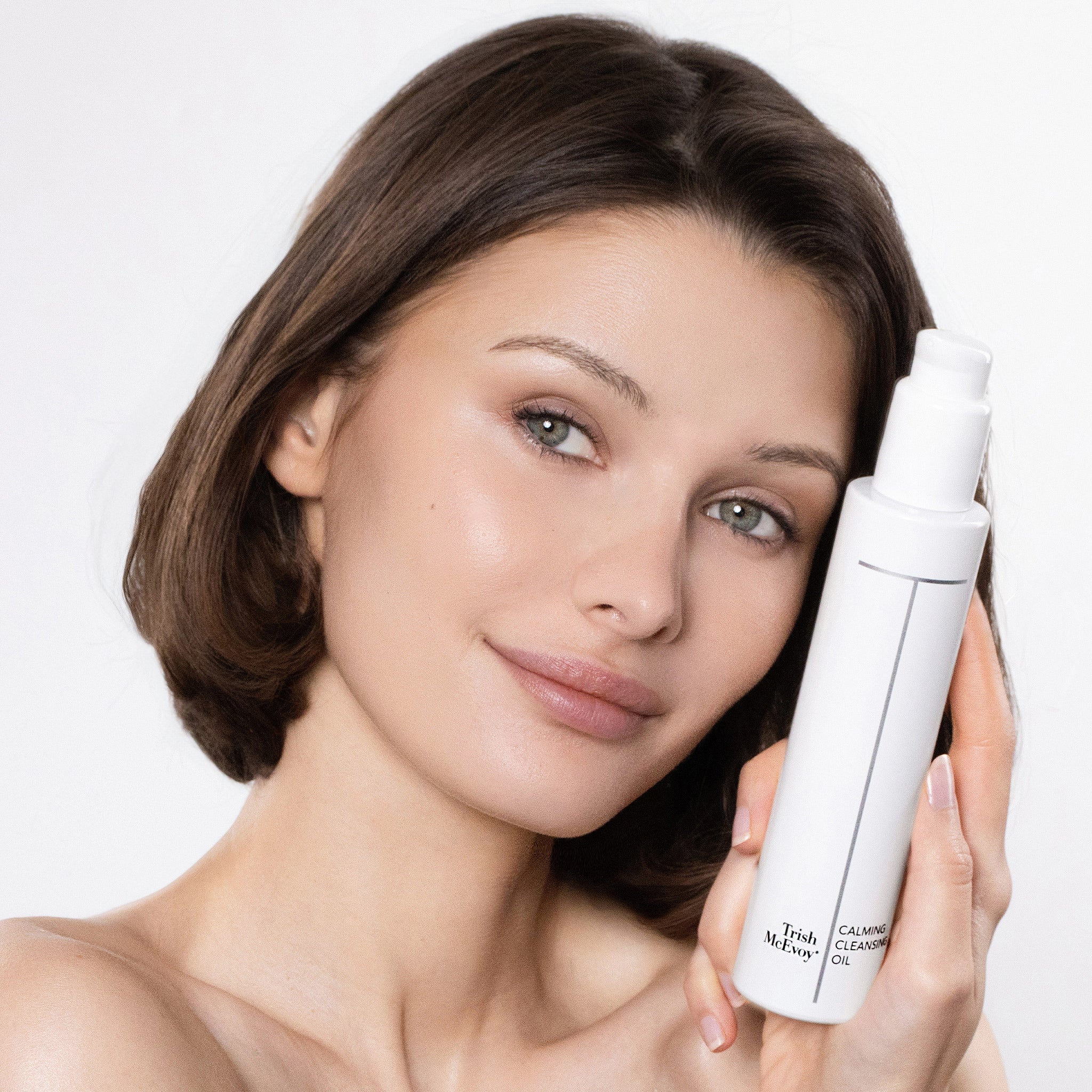 Woman holding Calming Cleansing oil