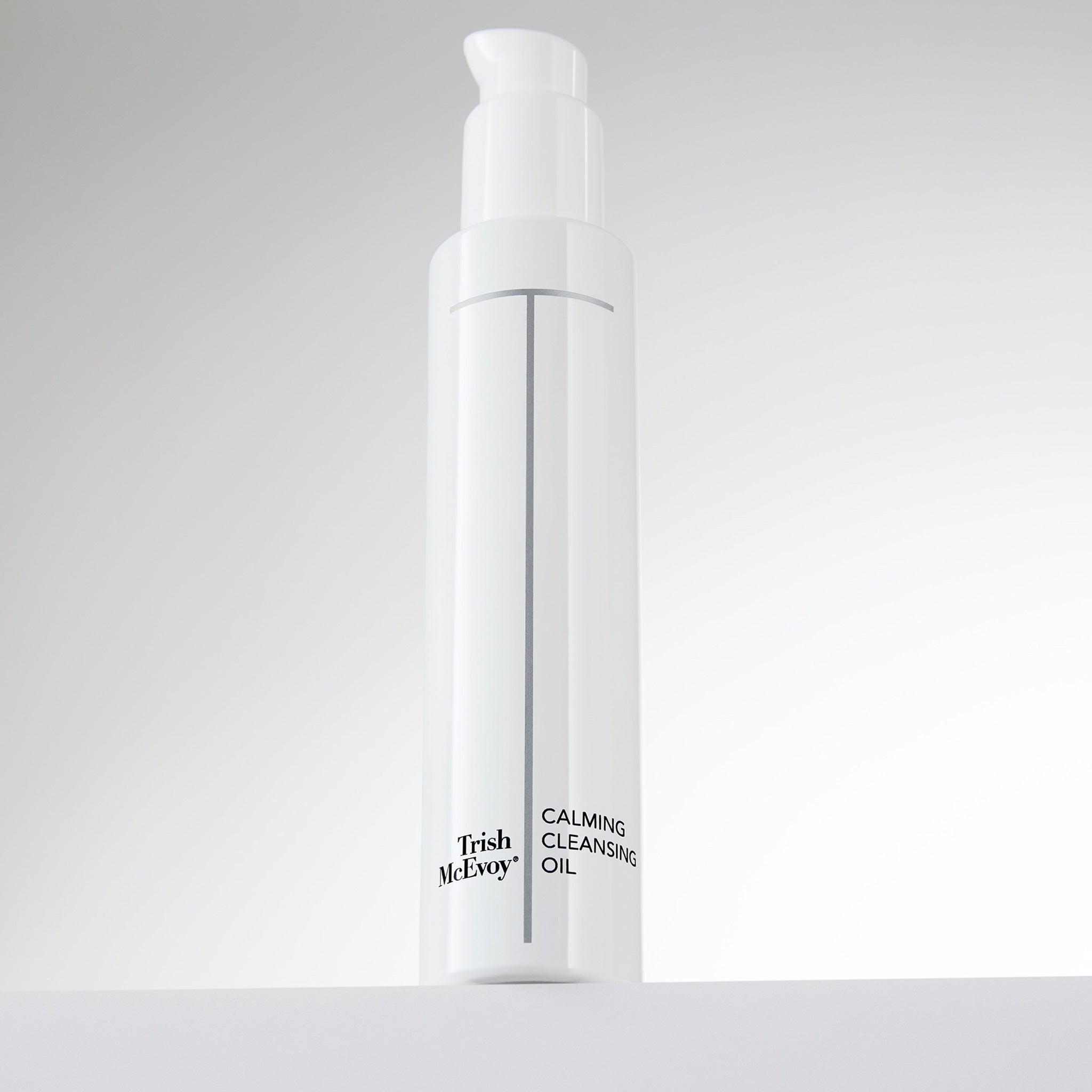 Trish McEvoy Calming Cleansing Oil bottle on a light gray background