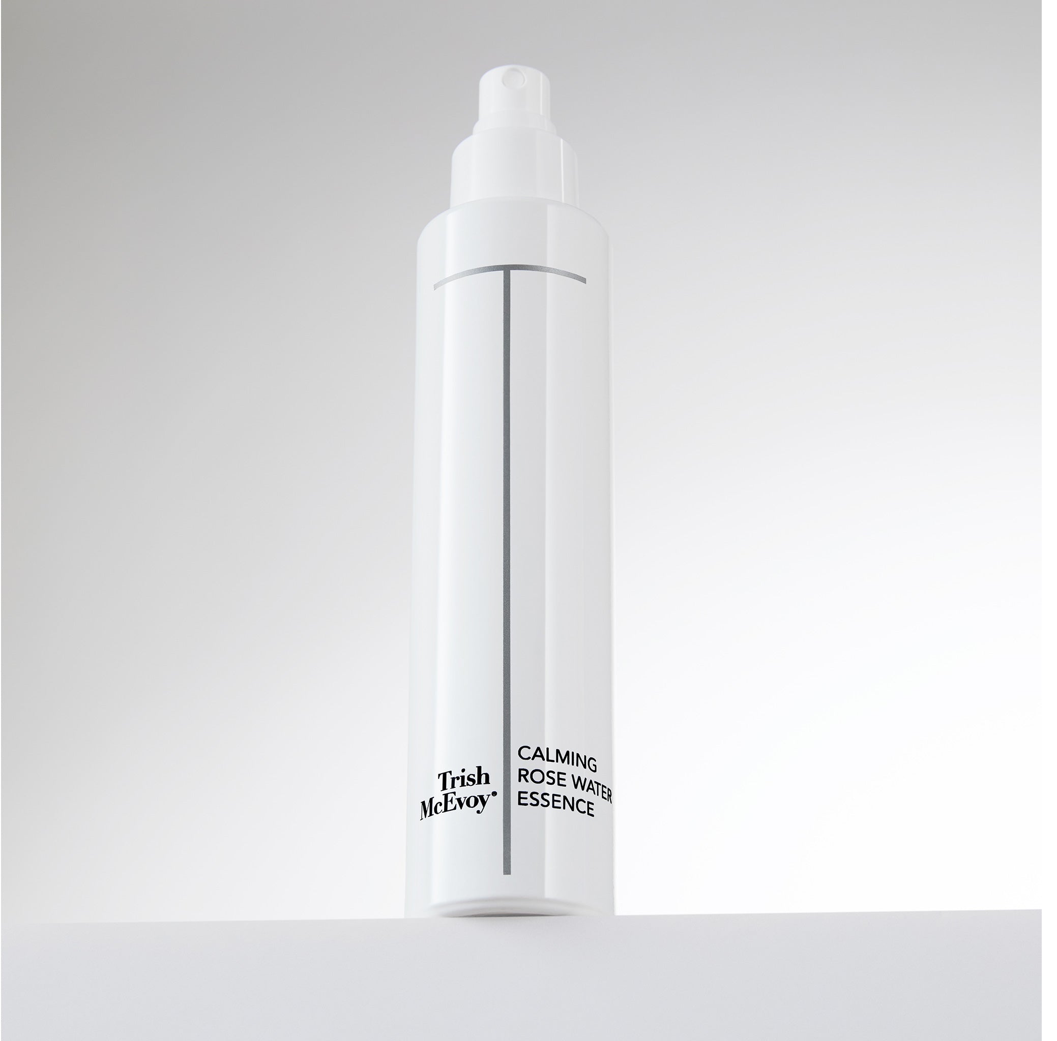 Trish McEvoy Calming Rose Water Essence bottle on a light gray background