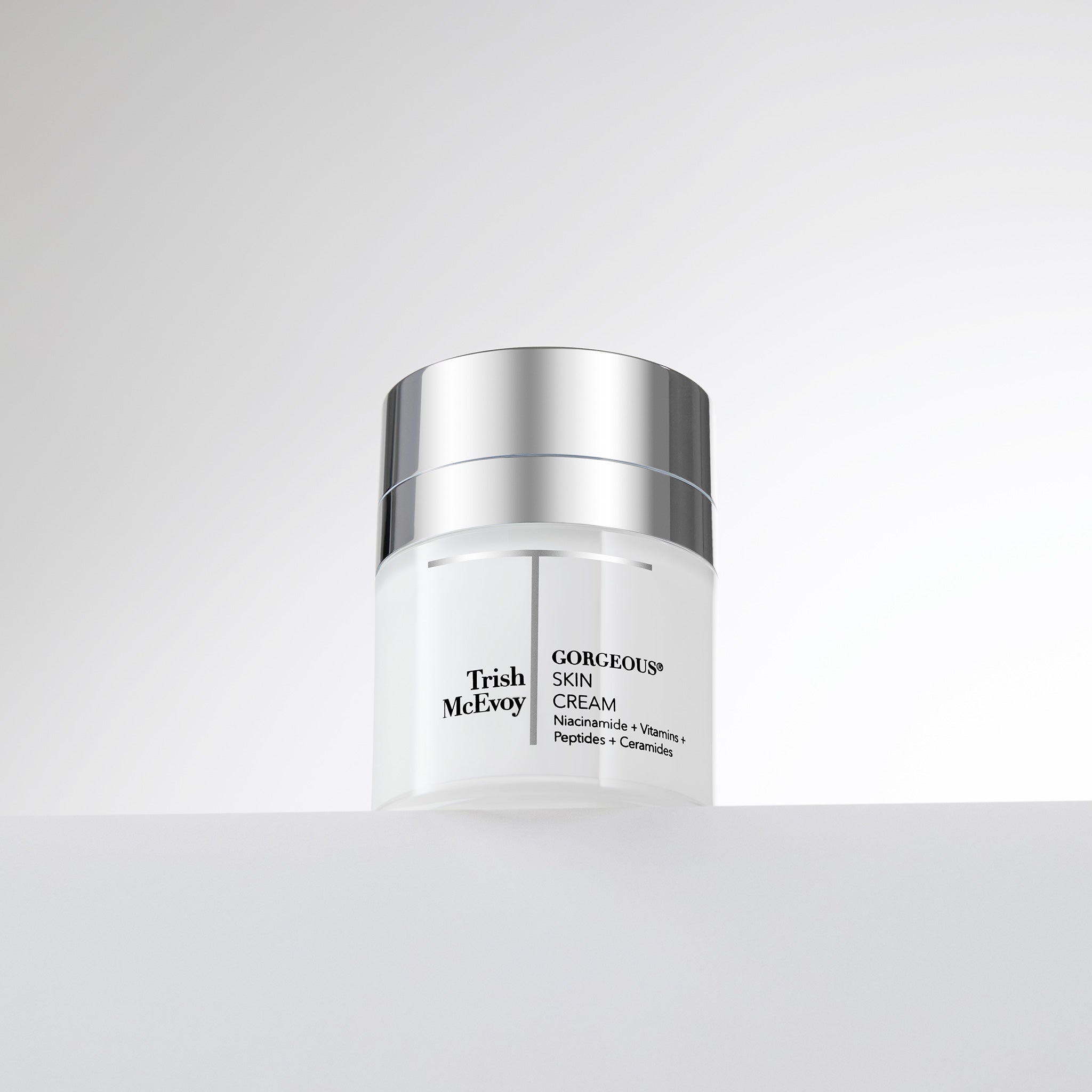 Trish McEvoy skincare jar on a light gray background
