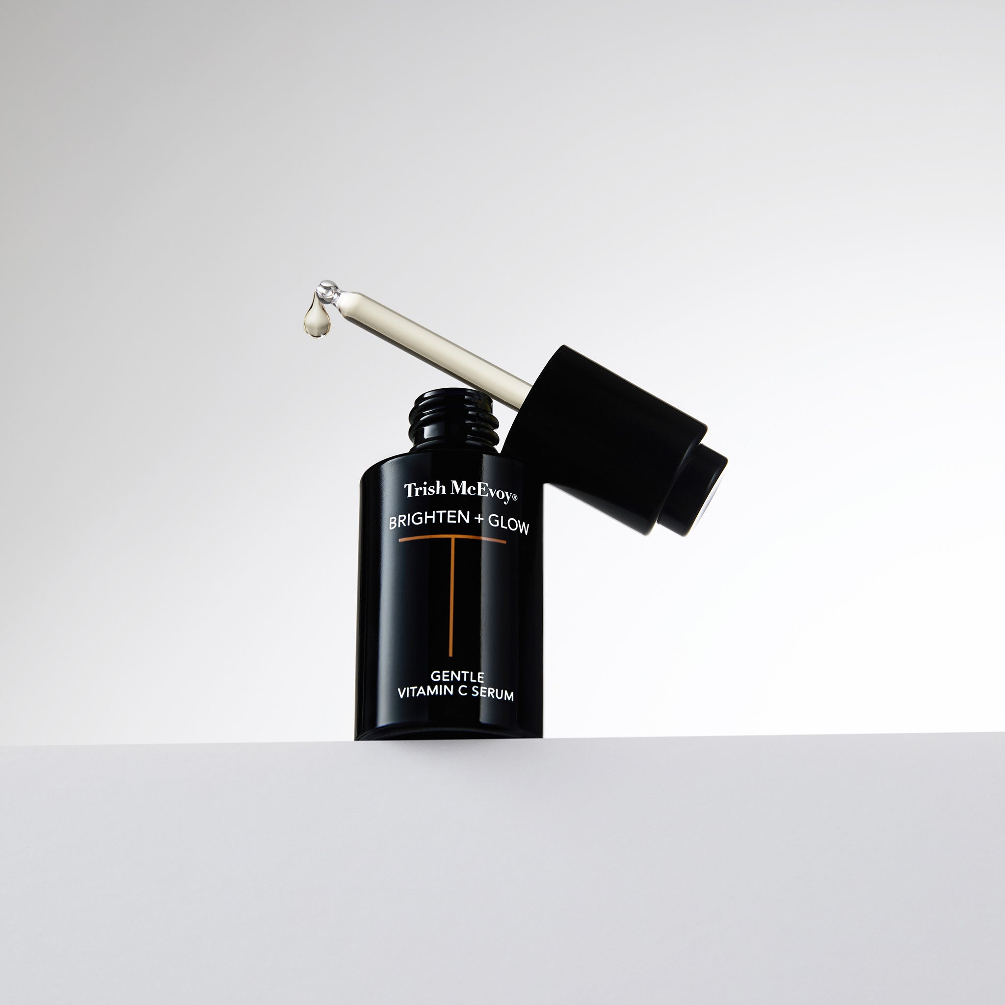 Trish McEvoy Vitamin C serum with applicator on a white background