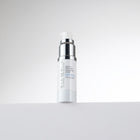 Skincare bottle with text on a light gray background