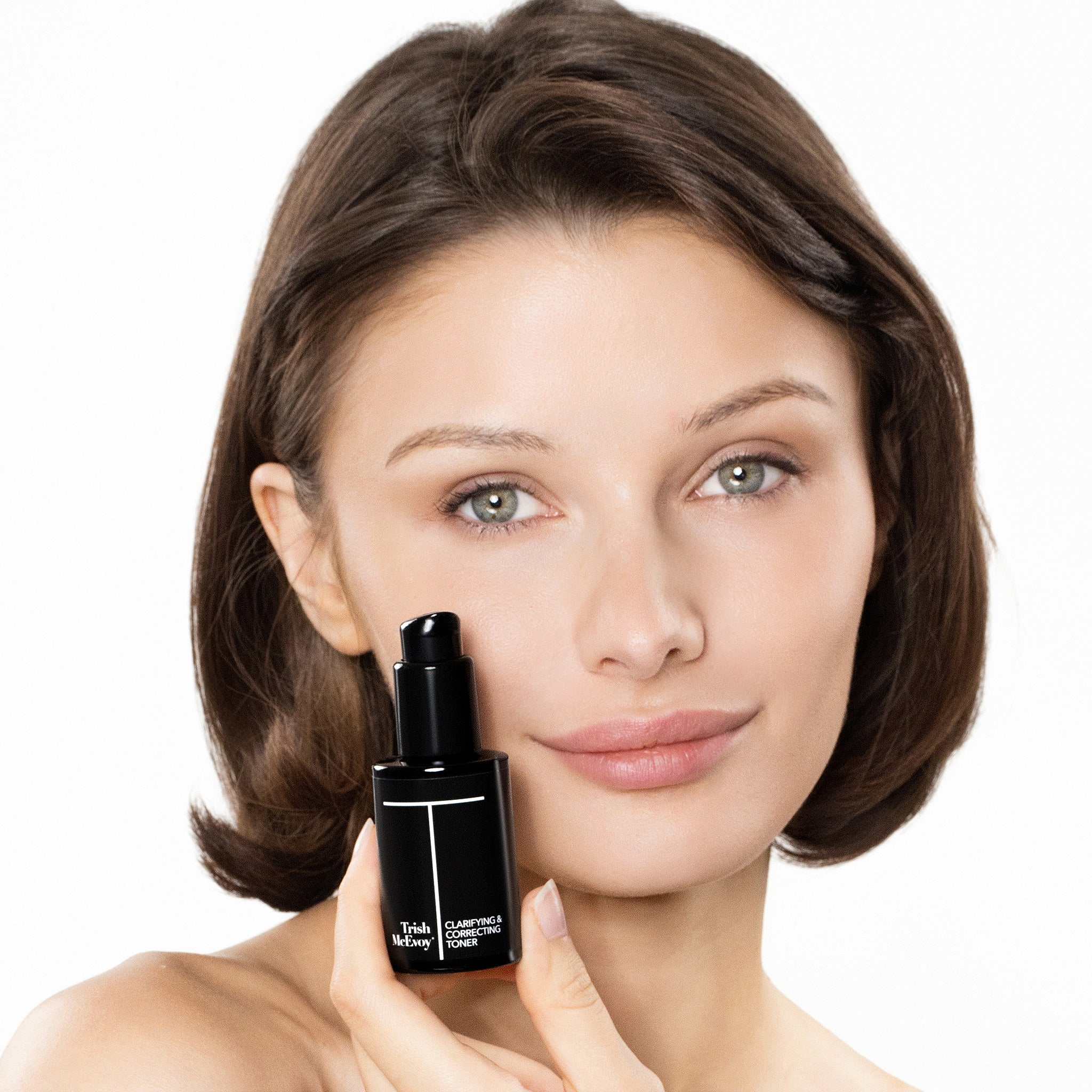 Woman holding Clarifying Correcting Toner bottle on a white background