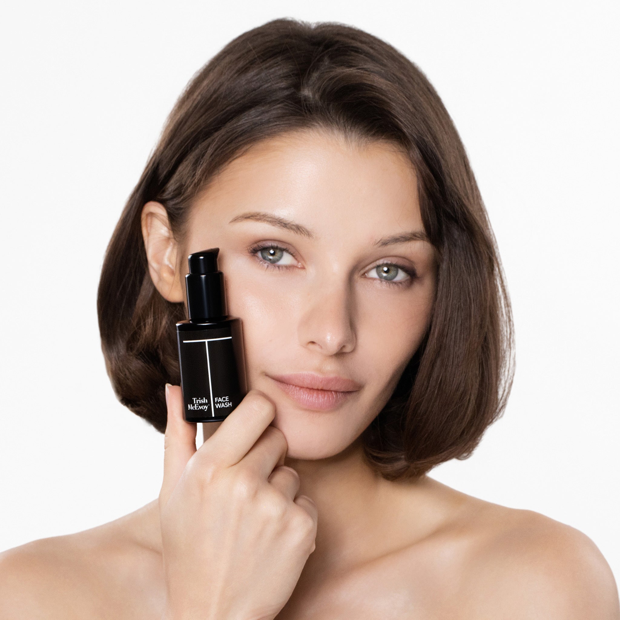 Woman holding face wash product