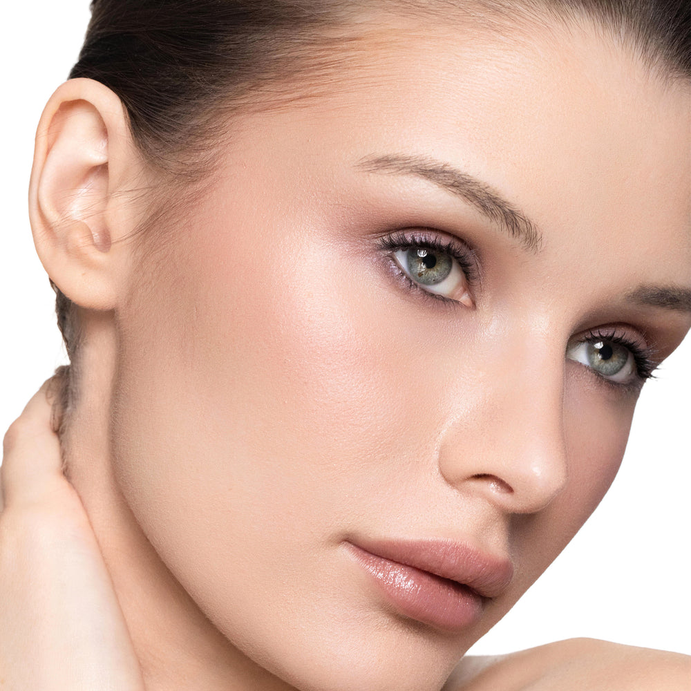 Close-up of a woman's face with color easy going blush