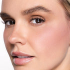 Close-up of a woman's face with color easy going blush