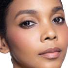 Close-up of a woman's face with  color happy blush