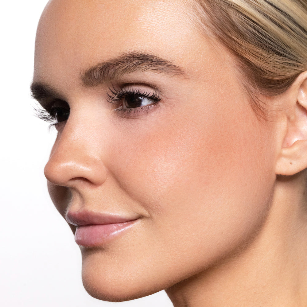 Close-up of a woman's face with color joyful blush