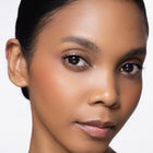 Close-up of a woman's face with color joyful blush
