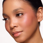 Close-up of a woman's face with color so sultry blush