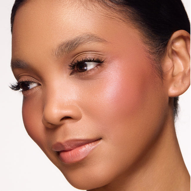 Close-up of a woman's face with color so sultry blush
