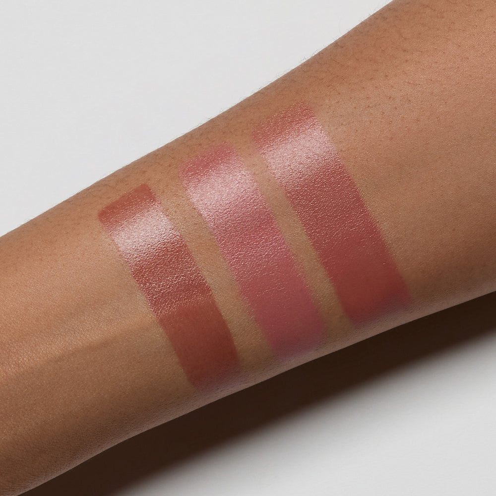 blush swatches on a person's arm with a neutral background