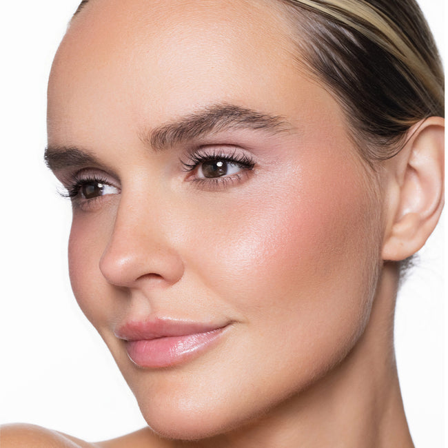 Close-up of a woman's face with so pretty cream blush