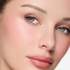 Close-up of a woman's face with color so pretty blush