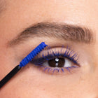 Close-up of an eye with color Arabian nights Mascara being applied