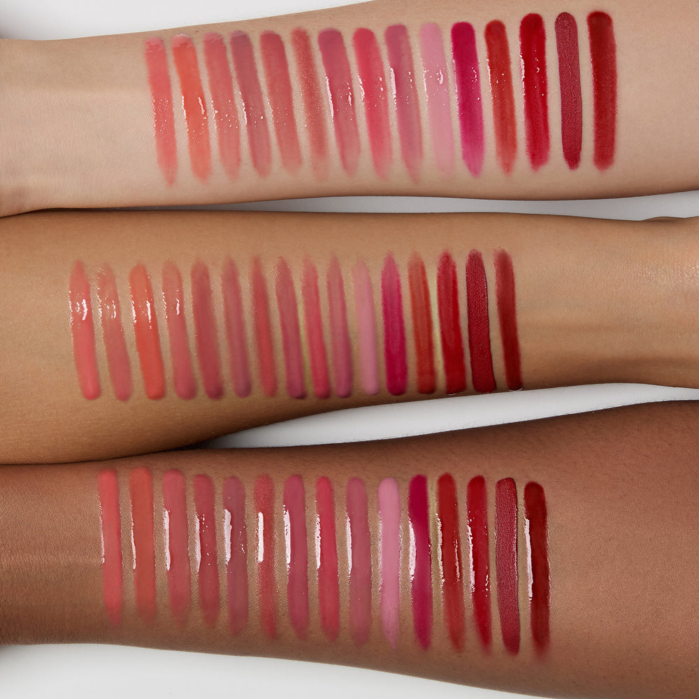 Lip gloss swatches on three different skin tones