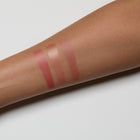swatches on a person's arm with a light background
