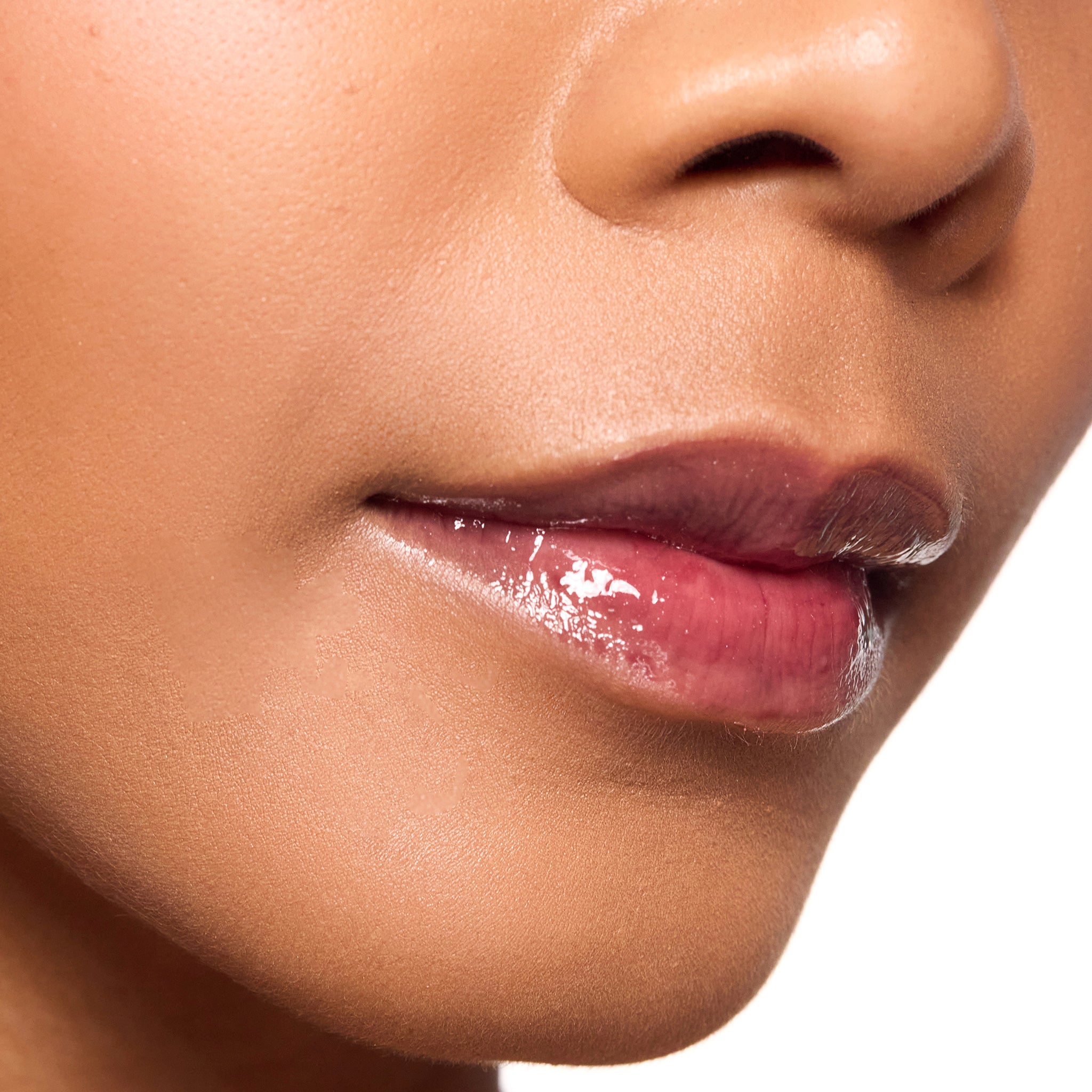 Close-up of a person's lips with color mulberry lipgloss