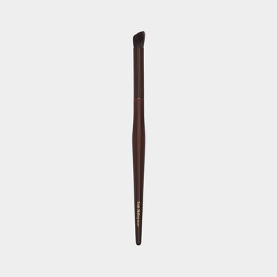 Makeup brush 23 define with brown handle and black bristle head on a white background