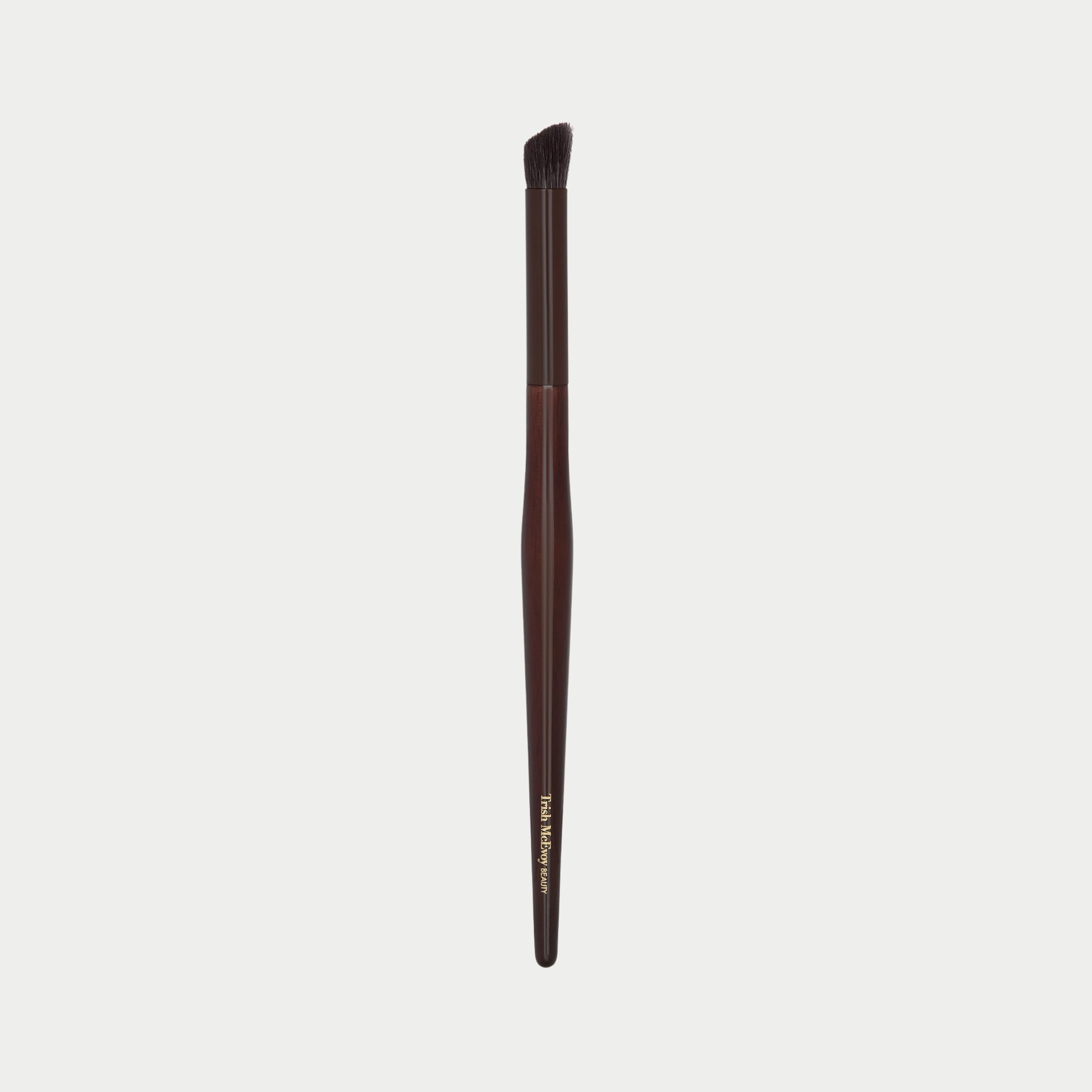 Makeup brush 23 with brown handle and black bristle head on a white background