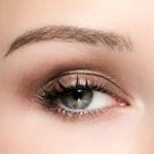 Close-up of a person's eye with color topaz eye makeup
