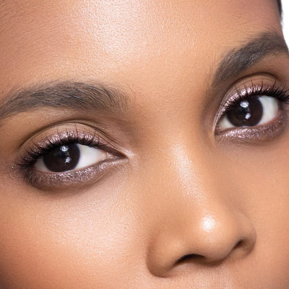 Close-up of a person's eyes with smoky Quartz eyeliner