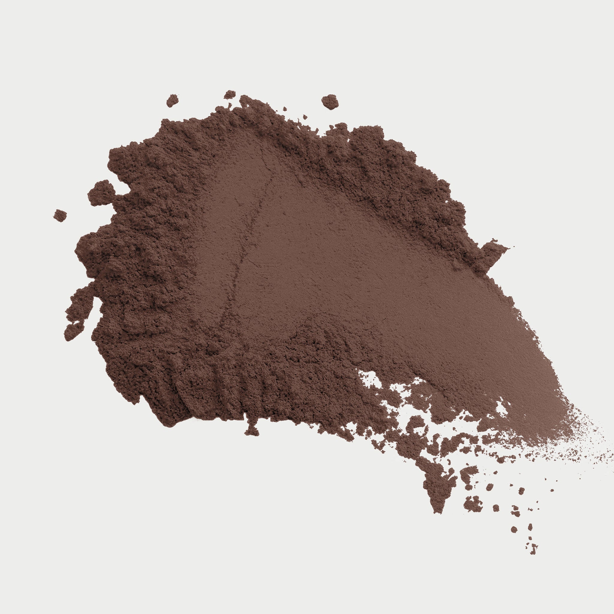 Brown powder on a light gray background