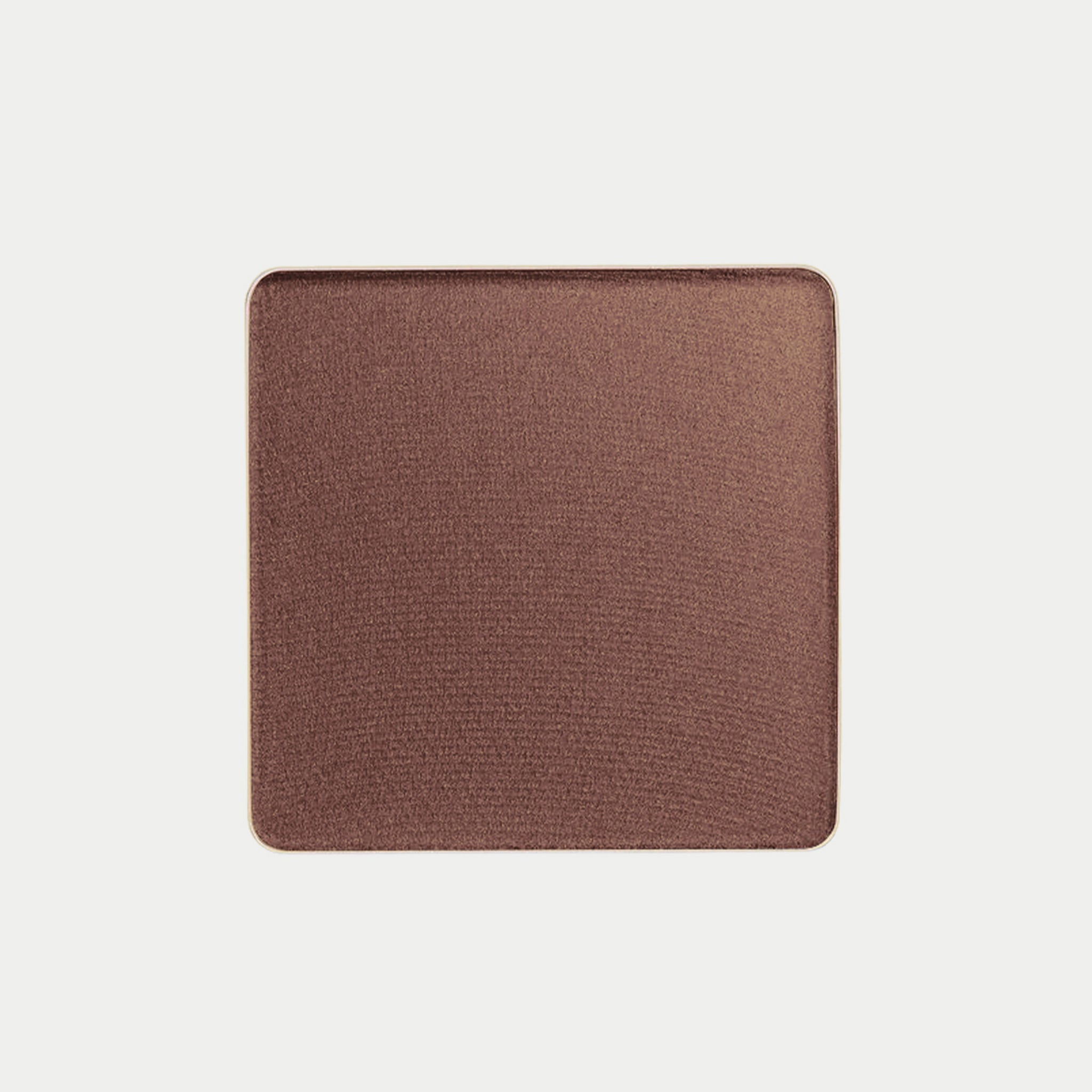 Brown square makeup compact on a light beige background