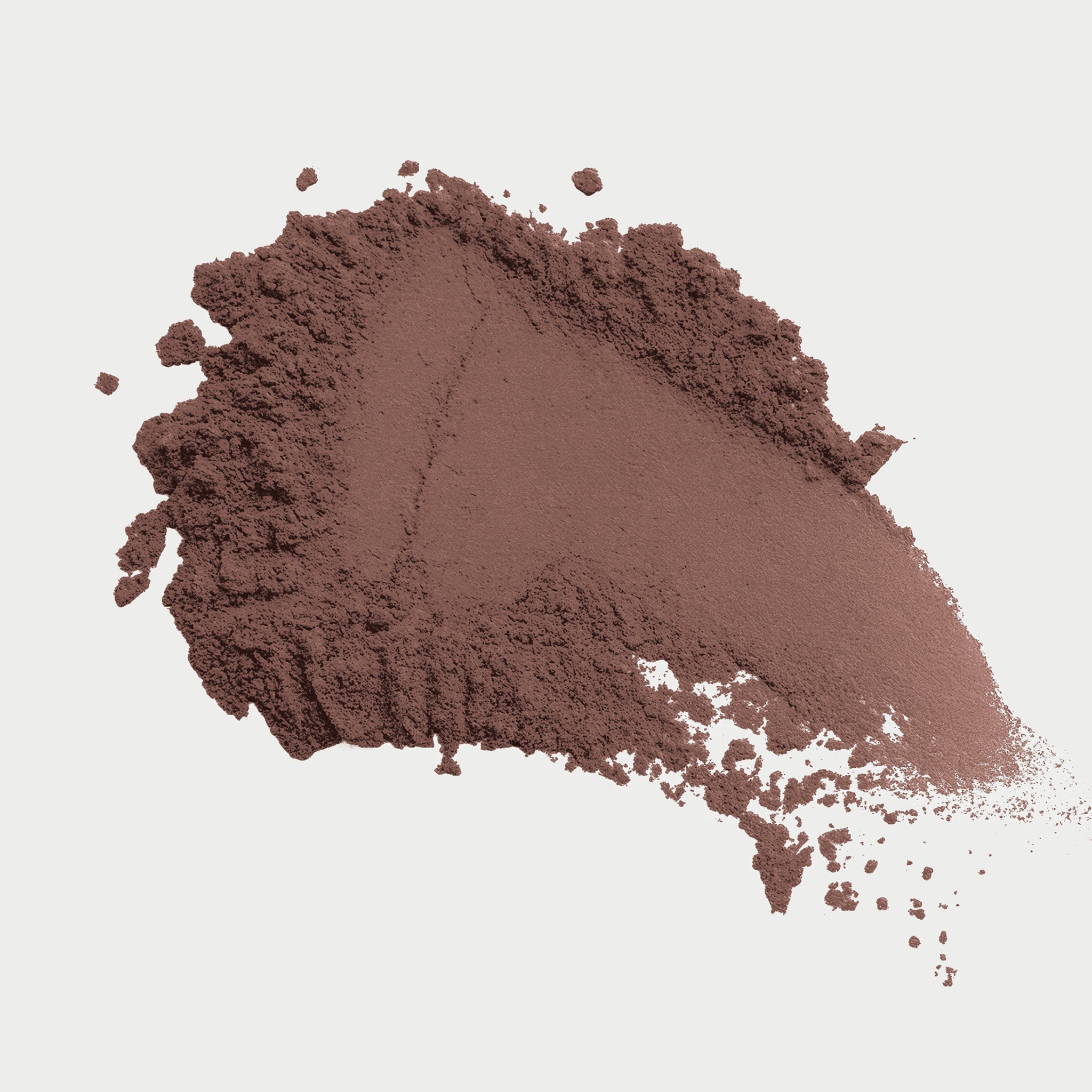 Brown powder on a light gray background