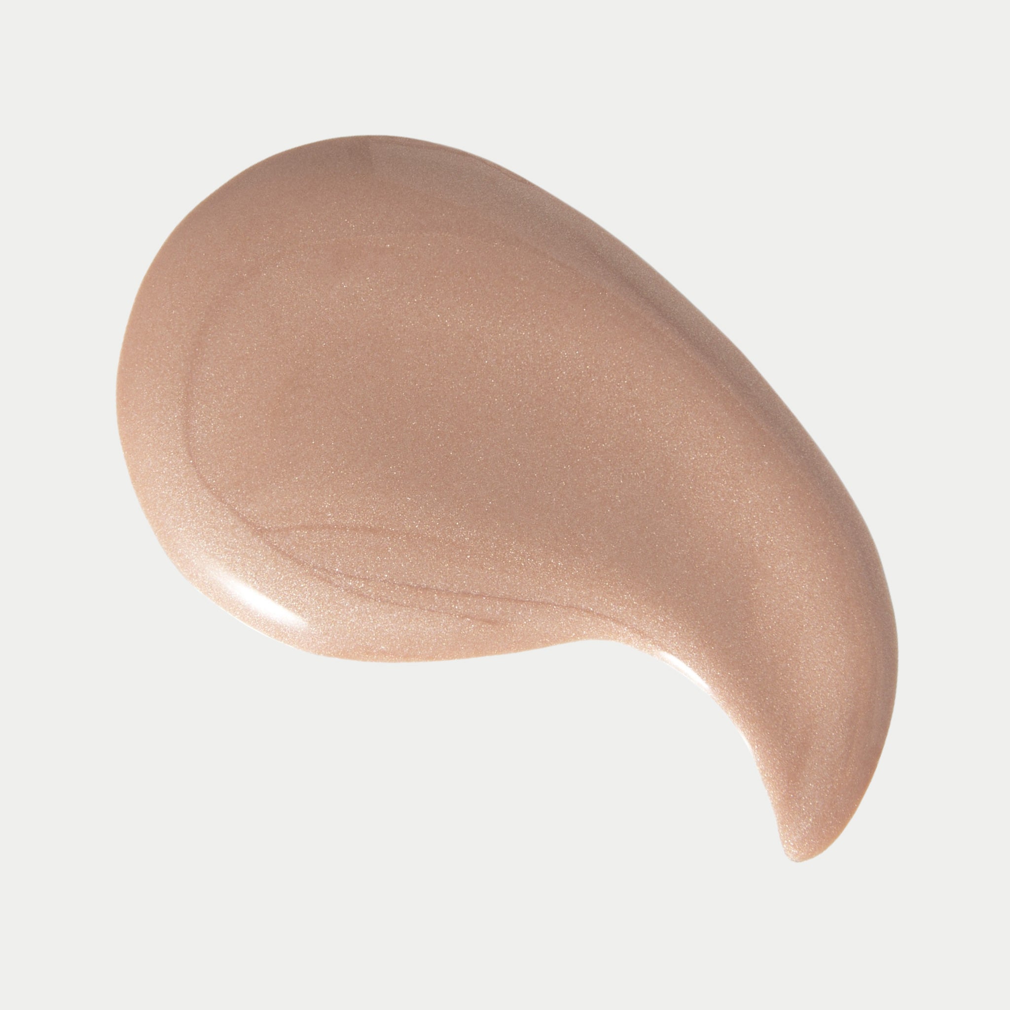 Beige cosmetic cream swatch on a light gray background