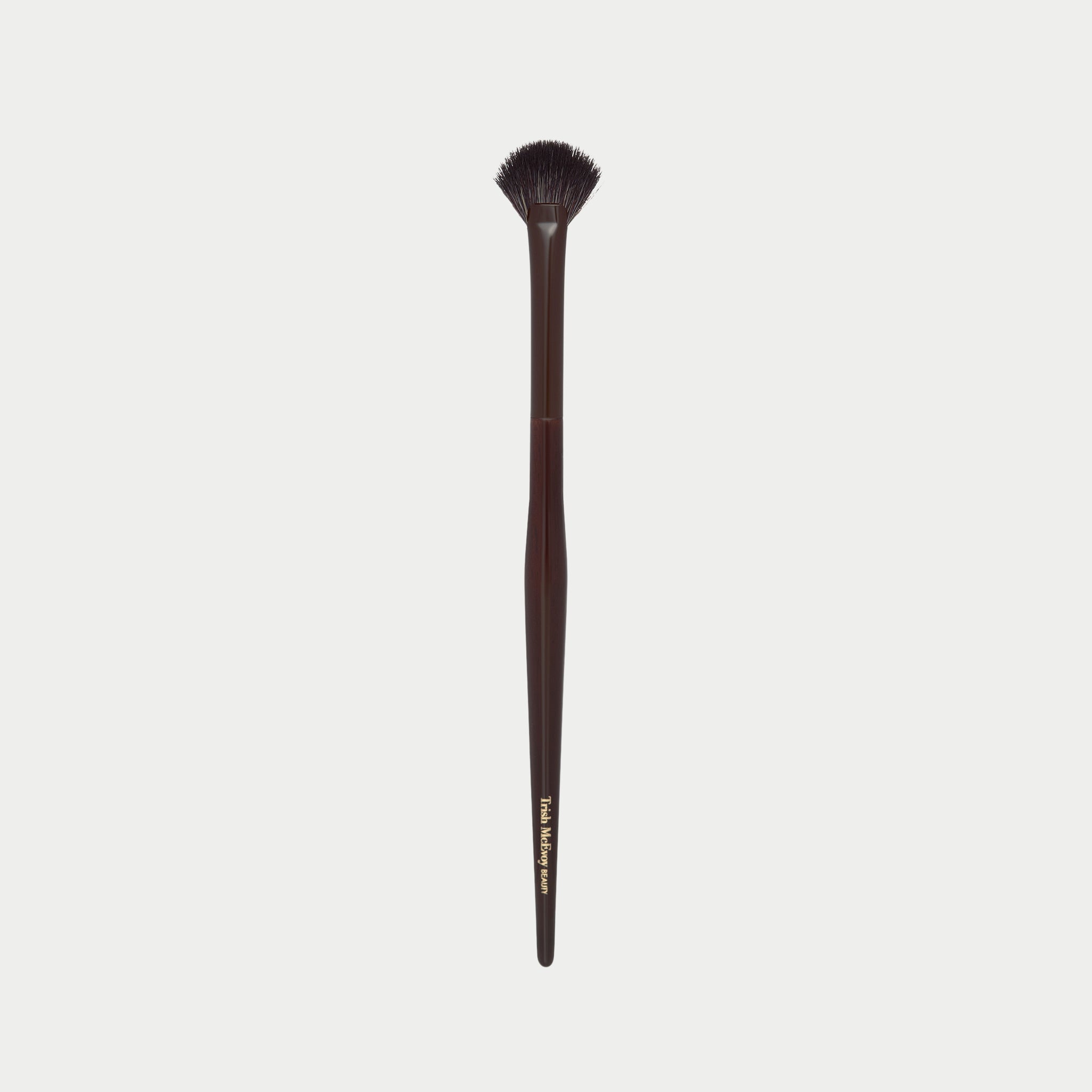 Makeup brush 63 with a wooden handle on a white background