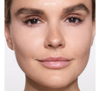 Close-up of a woman's face with 'BEFORE' text on a plain background