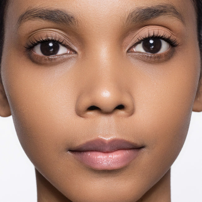 Close-up of a woman's face color deep eye base