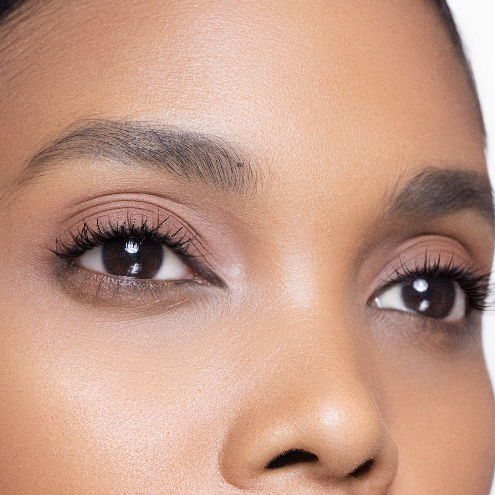 Close-up of a woman's face with colour inspired eye shadow