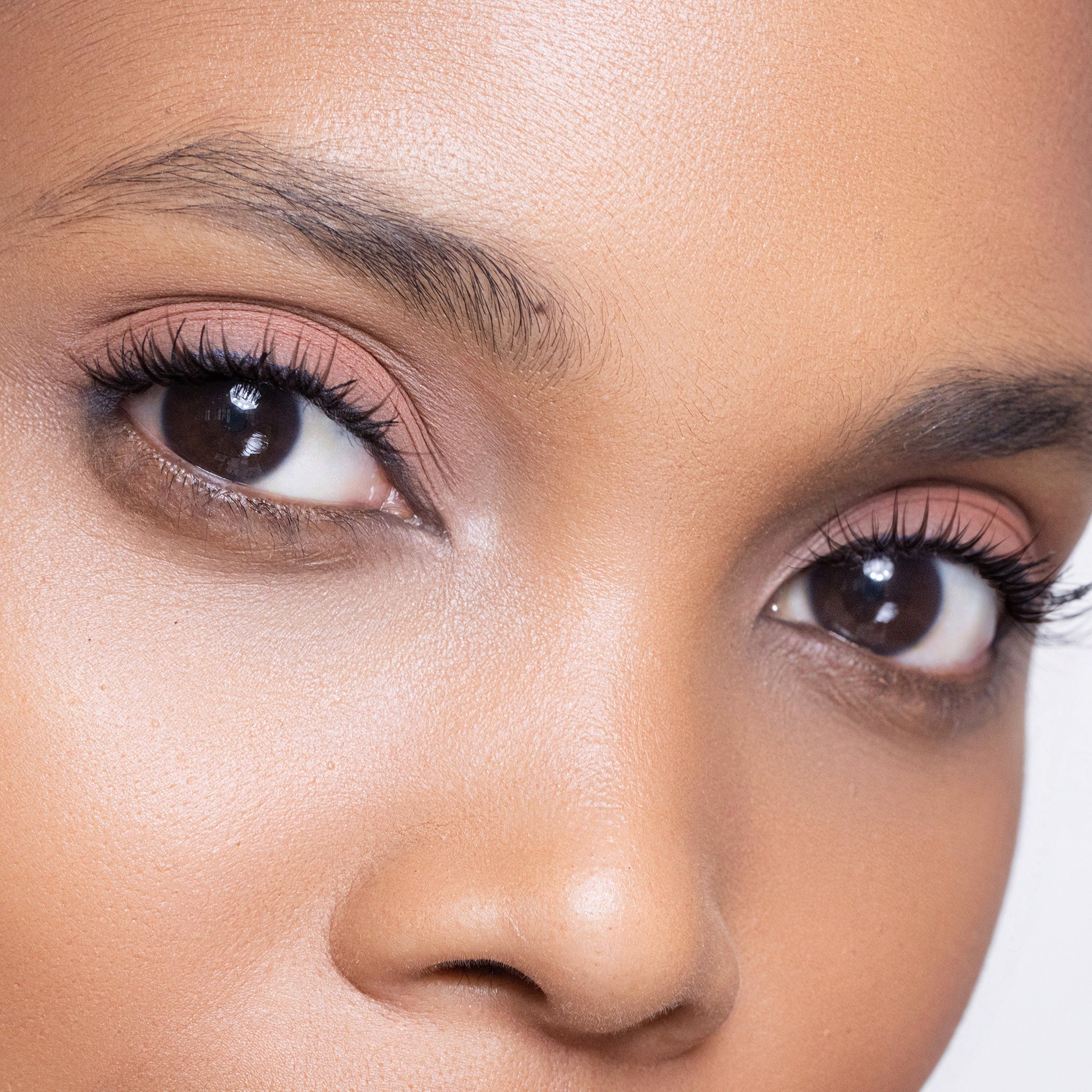 Close-up of a woman's face wearing color lover eye shadow