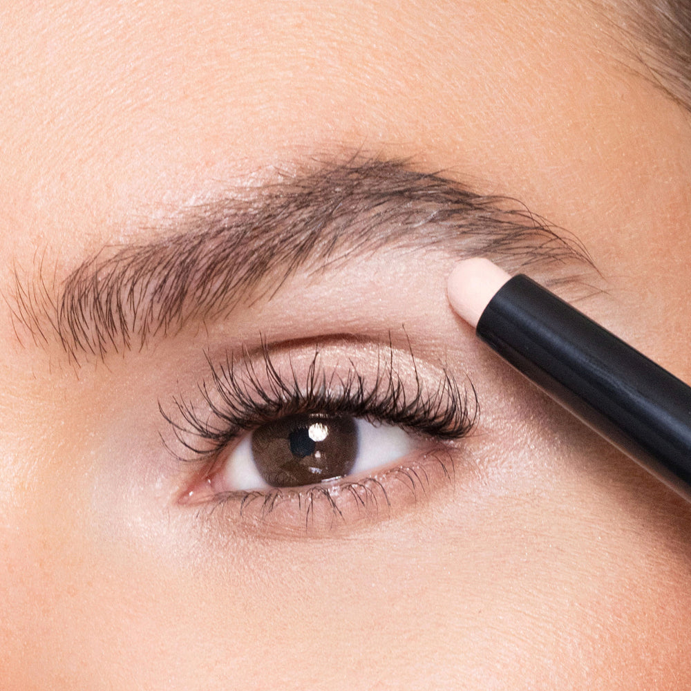 Person applying color shell eyeliner