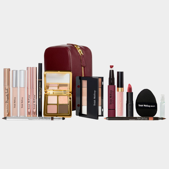 Makeup products including lipsticks, blushes, and a compact on a white background